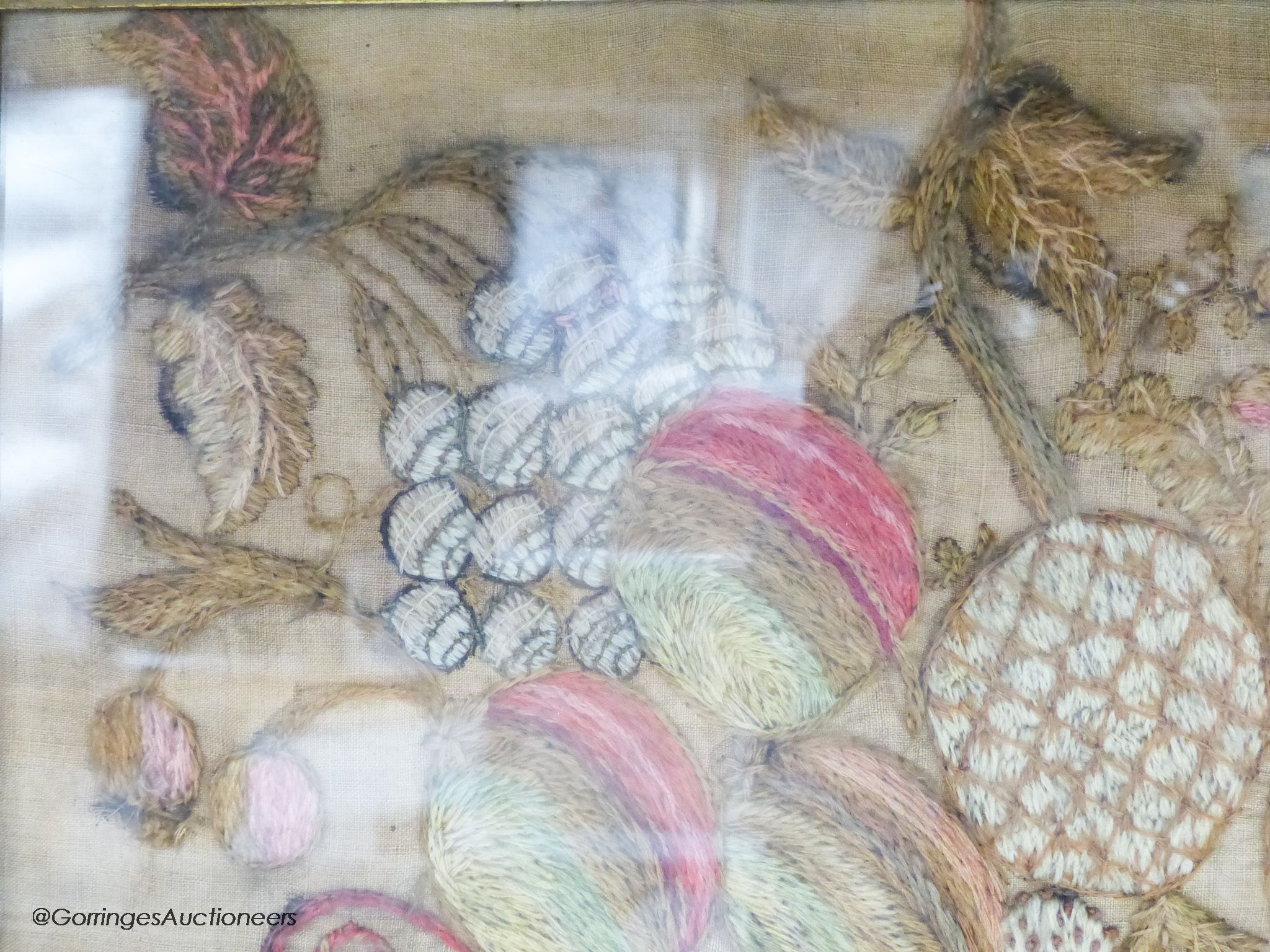 A George IV woolwork embroidered panel, by Ann Griffiths, dated 1818 and a George III needlework sampler dated 1786, 30cm sq.